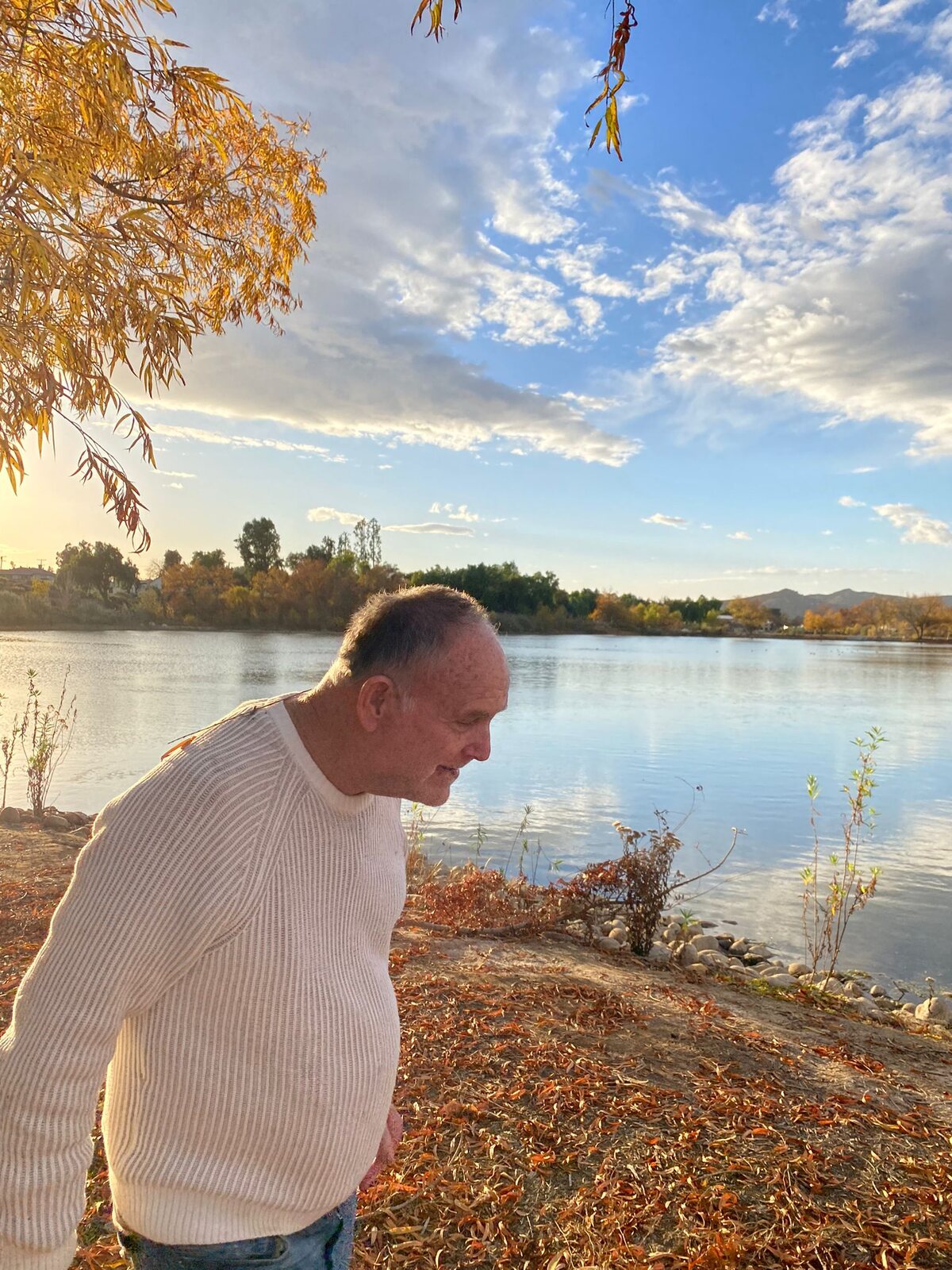 An ATS participant enjoying the sunset by the lake